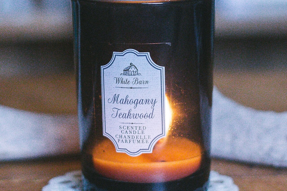 Lit Amber Scented Candle Burning